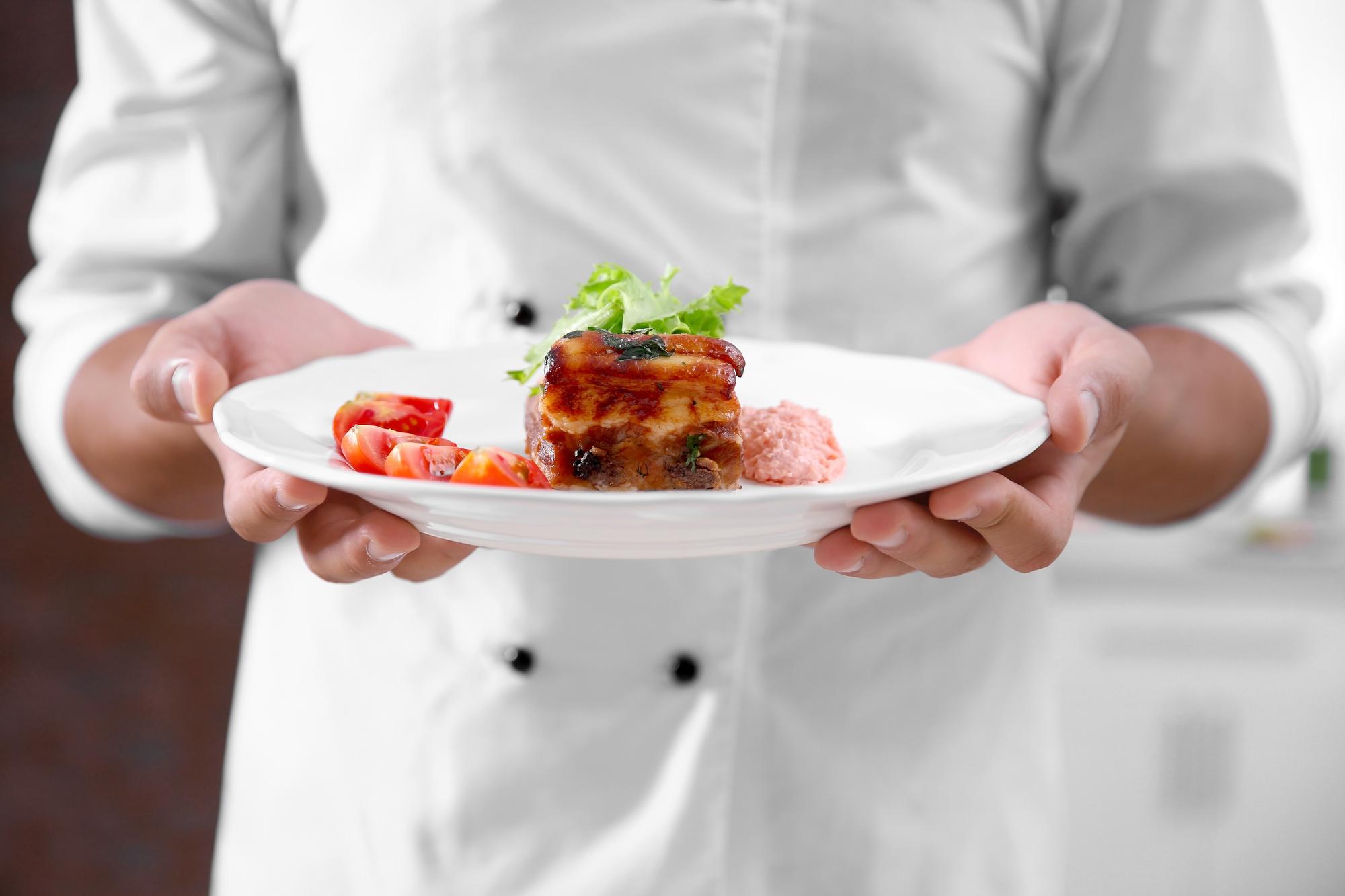 Chef presenting handcrafted plated dish